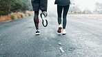 People, legs and running exercise on mountain together for workout commitment, personal trainer or back. Shoes, street and morning cardio with marathon sport for endurance goal, challenge or wellness