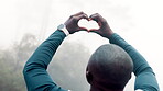 Fitness, heart hands and black man with smartwatch for wellness, exercise and workout progress. Sign, back view and male person with love emoji for training, healthy body and cardio in outdoor nature