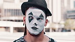 Thinking, mime and face of man in city for funny joke, humor and crazy facial expression. Theatre, street performer and portrait of person with paint mask for performance, entertainment and comedy