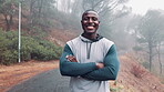 Black man, forest and smile for health with fitness or exercise on morning run with arms crossed in Atlanta. Portrait, outdoor and happy with dedication or commitment for workout and wellbeing 