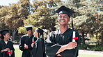 Happy man, student and graduation with confidence in nature for certificate, education or qualification. Portrait of confident male person or graduate with smile for diploma or degree at outdoor park