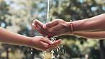 People, hands and water splash with nature for hydration, hygiene or natural sustainability at park. Closeup of liquid drops, cleansing or washing for healthcare, wellness or outdoor cleanliness
