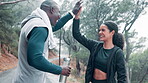 High five, fitness and happy couple for celebration, exercise and nature in morning. Smile, workout and cardio wellness for running training partners, water bottle and sports in mountain or forest