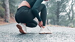 Ankle, pain and hands of woman outdoors for workout with discomfort or foot injury while running for morning routine. Female person, orthopedic and training or exercise for recovery or wellness.