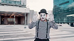 City, happy mime and face of man wave for hello, funny joke and facial expression with hands. Theatre, street performer and portrait of person in costume for performance, entertainment and comedy