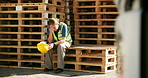 Stress, engineering and woman construction worker on site working on maintenance project, Headache, burnout and professional female industrial worker sitting on wood crates for repairs or building.