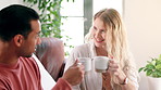 Morning, coffee and couple relax in home with espresso, latte or drink to start holiday or vacation. Matcha, green tea and people enjoy beverage on sofa in apartment on happy weekend or break