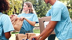 Donation, volunteering or people with teamwork at park with water, collection or community service. NGO, support and student friends celebrating earth day with charity, help or aid for poverty relief