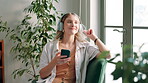 Woman, headphones and break with podcast, relax and rest at home or apartment living room. Lady, window and smartphone for learning, knowledge and story or information for happiness on sofa in lounge