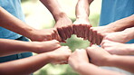 Hands, fist bump and people volunteering outdoor, NGO charity and social development support with trust in team. Community service, huddle and collaboration with solidarity for climate change mission
