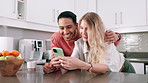 Phone, online and couple relax in home with food delivery website or scroll social media in kitchen. Happy, people and search internet for ecommerce restaurant or click app for shopping on smartphone