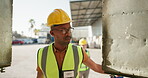 Construction, worker and man open container on site for working, staff and foreman or builder with helmet. Workplace, employee and male person in logistics industry in warehouse for cargo in storage