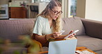 Living room, laptop and woman with shock at bill, paper and  phone for calculations of cost. Apartment, home and female person with glasses on sofa with receipt for payment of mortgage or loan