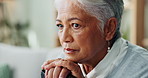 Elderly woman, closeup and thinking with cane for disability, retirement and healthcare at nursing home. Senior person, walking stick and sad on sofa for arthritis, assistance and mental health