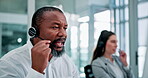 Man, headset and call centre by computer for consulting, telemarketer and insurance hotline. Black person, communication and helpdesk for technical support, representative and operator for assistance