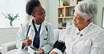 Elderly, woman and doctor with monitor for blood pressure with hypertension diagnosis, medical test and cardiovascular. Senior patient, nurse and laughing in nursing home for healthcare assessment