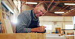 Mature man, carpentry and wood at workshop with filling or puttying for furniture and design. Carpenter, tools and repair on startup business as manager or supervisor in warehouse or factory. 
