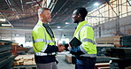 Handshake, teamwork and men in discussion in warehouse for construction, logistics and maintenance. Distribution, factory and people shaking hands for thank you, infrastructure and manufacturing