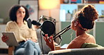 Woman, interview and podcast with celebrity for discussion, conversation or career news at home studio. Female person talking with client on air with mic for communication, live chat or recording