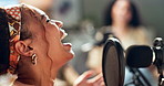 Woman, mic for broadcast and talking for radio, media for communication and comedy. Live streaming, podcast and social network, content creator with platform and funny story in recording studio