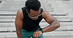City, steps and tired black man with smart watch for fitness, workout or cardio training. Stop, breathe or African male runner with sports, fatigue or pause after stairs, run or  stopwatch challenge