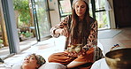 Sound, meditation and relax with Tibetan singing bowl for indigenous spiritual healing in holistic practice. Soul, music and couple listen to vibration on trippy instrument to balance chakra for zen