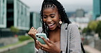Wow, phone and excited black woman in city with winner fist, celebration or competition prize notification. Smartphone, yes and happy African entrepreneur with travel, deal or immigration opportunity