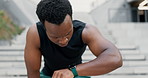 Steps, city and tired black man with smart watch for fitness, workout or cardio training. Stop, breathe or African male runner with sports, fatigue or pause after stairs, run or  stopwatch challenge