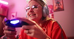 Headphones, happy woman and play video game in home for competition and online rpg. Controller, girl and smile of person on console technology for entertainment with neon light in apartment at night