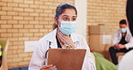 Doctor, patient and health outreach for community service with consultation, throat infection or clipboard. NGO, charity and woman in discussion for medical support or social responsibility with mask