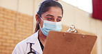 Doctor, clipboard or mask in vaccination, consultation or question of compliance, health insurance. Woman, physician or paperwork in communication, risk or advice as healthcare services in hospital