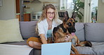 Female, sofa and animal on laptop with glasses at house, emotional support dog for love. Woman, couch and German Shepherd with technology and specs for education, internet or online and connection