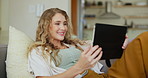 Sofa, relax and woman with tablet in living room for streaming, comedy movie or online film at home. Smile, laugh and female person with digital technology for funny post, internet or social media