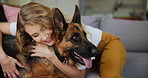 Smile, cuddle or hug with woman and dog on sofa in living room of home together for pet owner bonding. Love, trust or relax with happy young person and Alsatian in apartment for care or loyalty