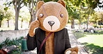 Person, phone call and bear costume outdoor, communication and contact with connectivity for chat. Conversation, actor and dress up as mascot, cosplay and theatre with networking for acting job