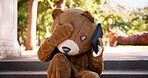 Angry, person or call as problem, stress or bear costume in argument, conversation or fight in park. Mascot, street performer or actor to gesture in frustration, anxiety or ask questions to fix error