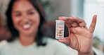 Hands, tablets and woman with a bottle of medicine for pain, supplement or vitamin c in home. Closeup, blur and female person with pills, container or medical capsule for health, anxiety or virus