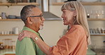 Happiness, senior couple and dance in home for celebration, romance or anniversary. Elderly man, woman and moving to music for love, smile or laughing for interracial relationship together in house