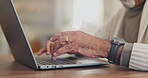 Senior man, hands and laptop for typing in home, online search and scroll on news website. Elderly male person, writing and network for communication, closeup and internet banking in retirement