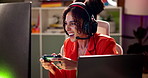 Gaming, video game and woman on computer at night for entertainment, online games and esports. Gamer, neon light and person with headphones and controller for virtual media, streaming and competition