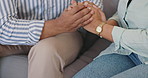 Couple, concern and hands together with support in stress, anxiety or mental health on sofa at home. Closeup of man or woman touching with understanding for trust, care or comfort in relief or crisis