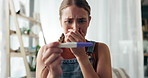 Stress, fear and woman with pregnancy test in house with panic, anxiety or unexpected results. Pregnant, depression or girl overwhelmed by testing kit news, regret or disaster mistake in home crisis