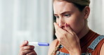 Stress, panic and woman with pregnancy test in house with fear, anxiety or unexpected results. Pregnant, depression or girl overwhelmed by testing kit news, regret or disaster mistake in home crisis