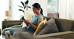 Home, woman and smartphone with typing, relax and online reading for social media and message a contact. Apartment, person on a sofa or girl with a cellphone and mobile user with digital app or email