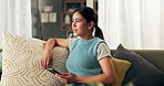Woman, cellphone and thinking on sofa for texting reply or email notification for social media post, connectivity or thoughts. Female person, smartphone and wondering in living room, app or network