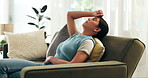 Girl, calm and relax on sofa in home on Saturday afternoon for weekend break, eyes closed and discomfort of stomach or abdominal pain. Woman, rest and menstruation cramps on couch and uncomfortable.
