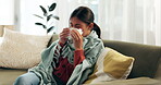 Woman, sick and blowing nose on couch for flu illness or sneezing disease with blanket, allergy or virus. Female person, tissue and sofa in home for bacteria problem in lounge, sinus or influenza