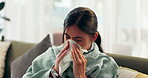 Woman, sick and tissue with blowing nose in home for respiratory influence, illness or cold. Female person, blanket and fever flu or virus suffering in living room with allergies, sneezing or fatigue