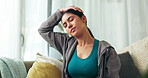 Woman, sofa and exercise with stretching neck for healthy living, warm up and relax at home for self care. Female person, cardio and fitness or workout  in lounge on couch for wellbeing in sportswear