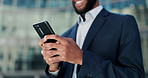 Businessman, hands and typing with phone in city for communication, social media or outdoor networking. Closeup of man or employee smile with mobile smartphone for online chatting or texting in town